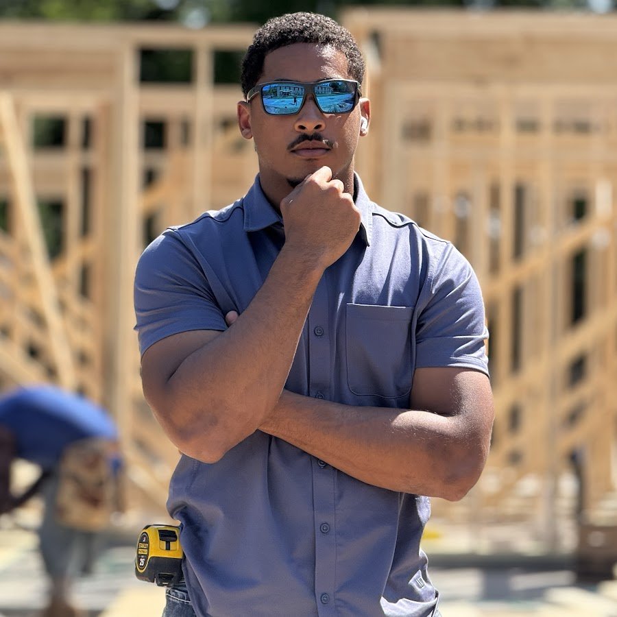 Corey Fields Jr. on a framing jobsite, tape measure on his belt